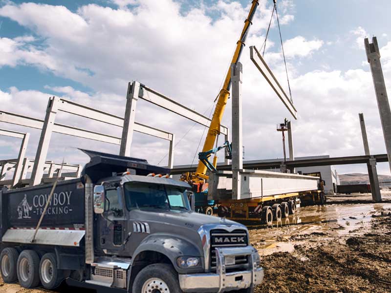A truck parked in front of a construction site to illustrate the topic of a highway construction company coordinating or reacting to events